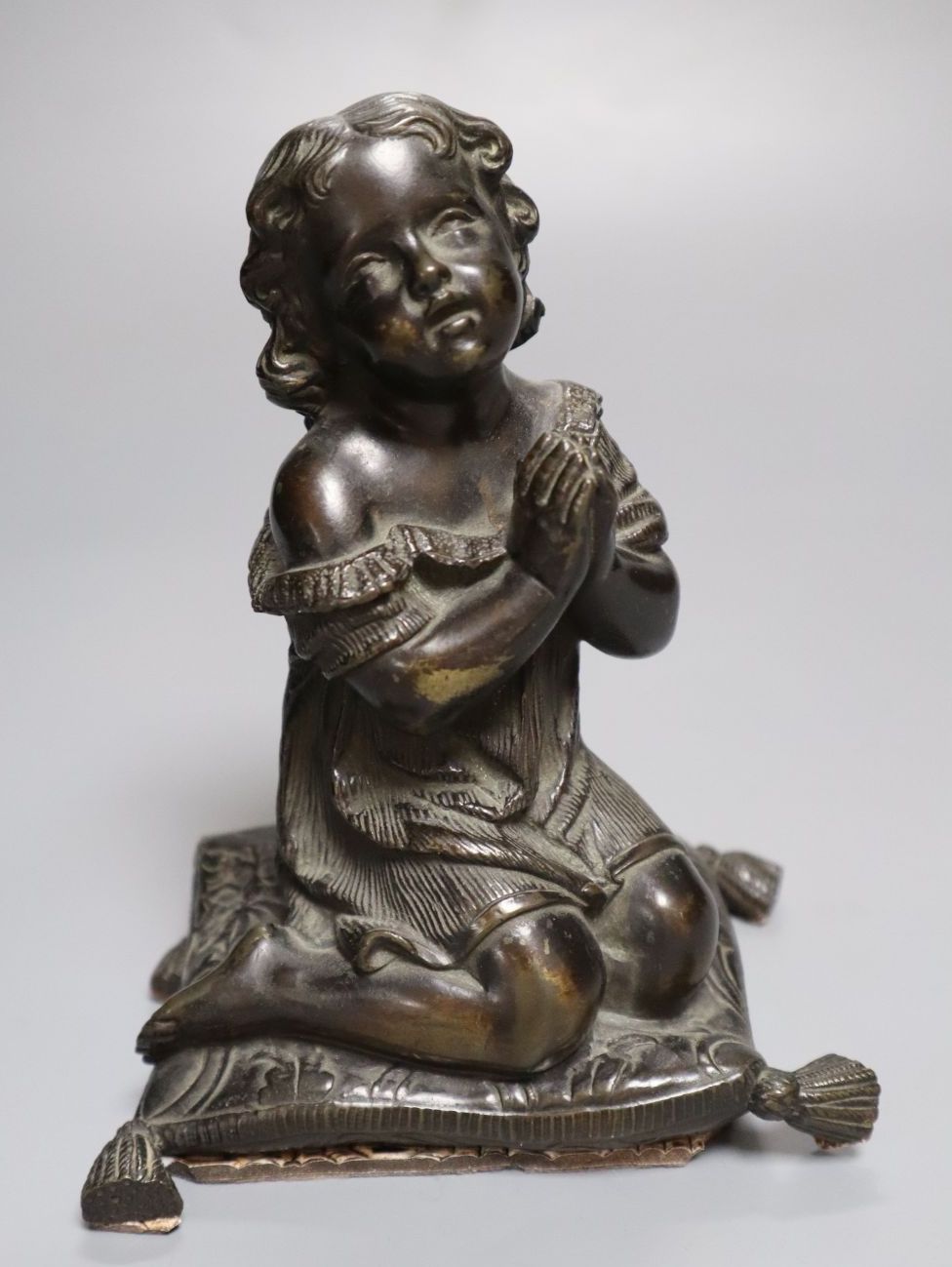 A bronze figure, girl kneeling at prayer, unsigned, 16cm